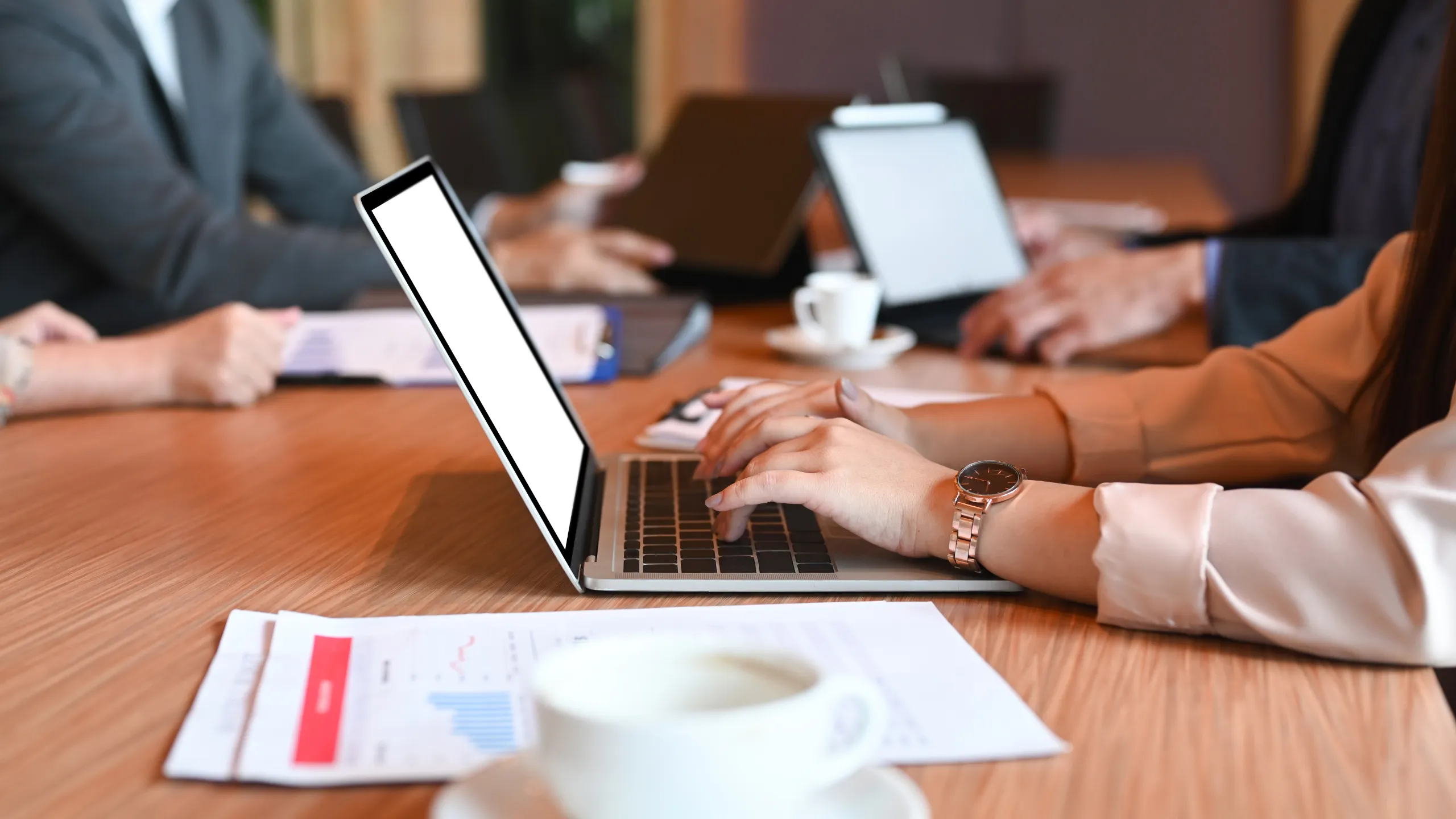 Business professionals working on laptops with Managed IT Services Melbourne support